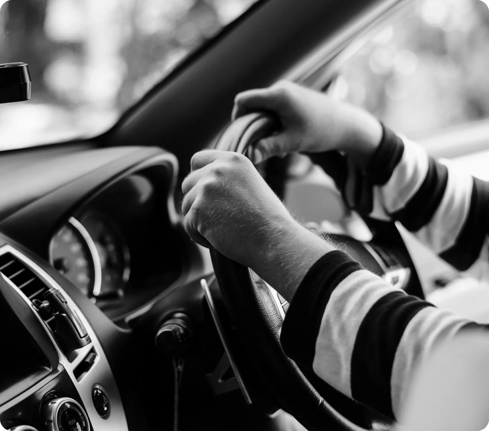 Driver holding the steering wheel of a vehicle